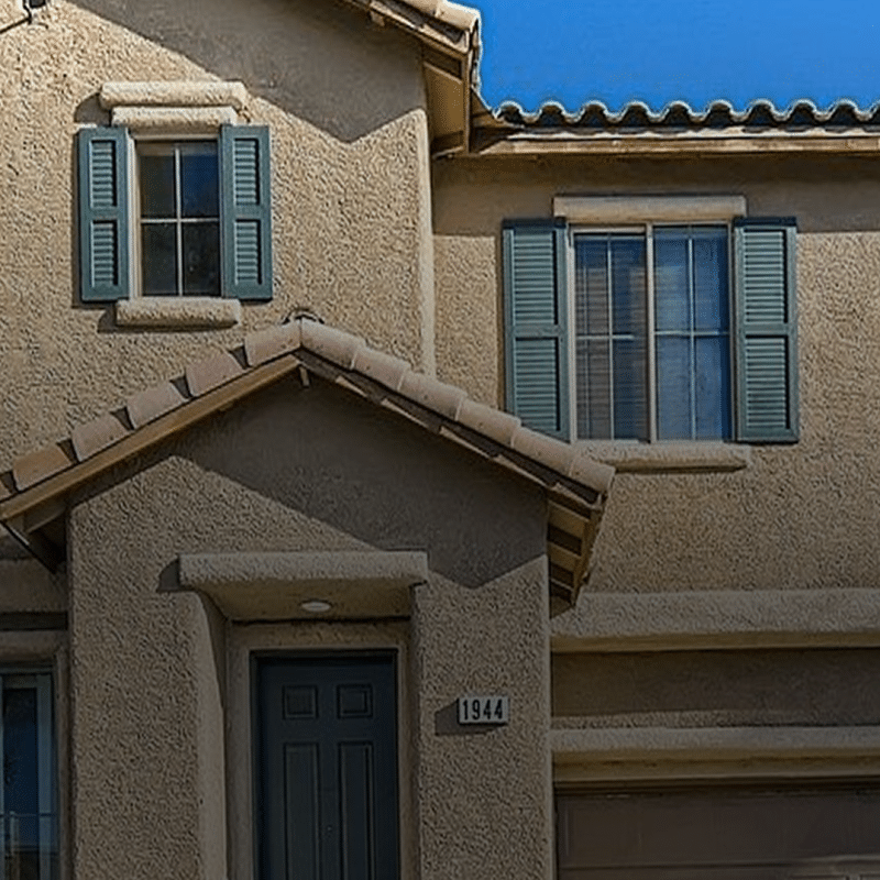 Selling a House With Solar Panels in Las Vegas: Leased vs. Owned 2 Two-story house with blue shutters.