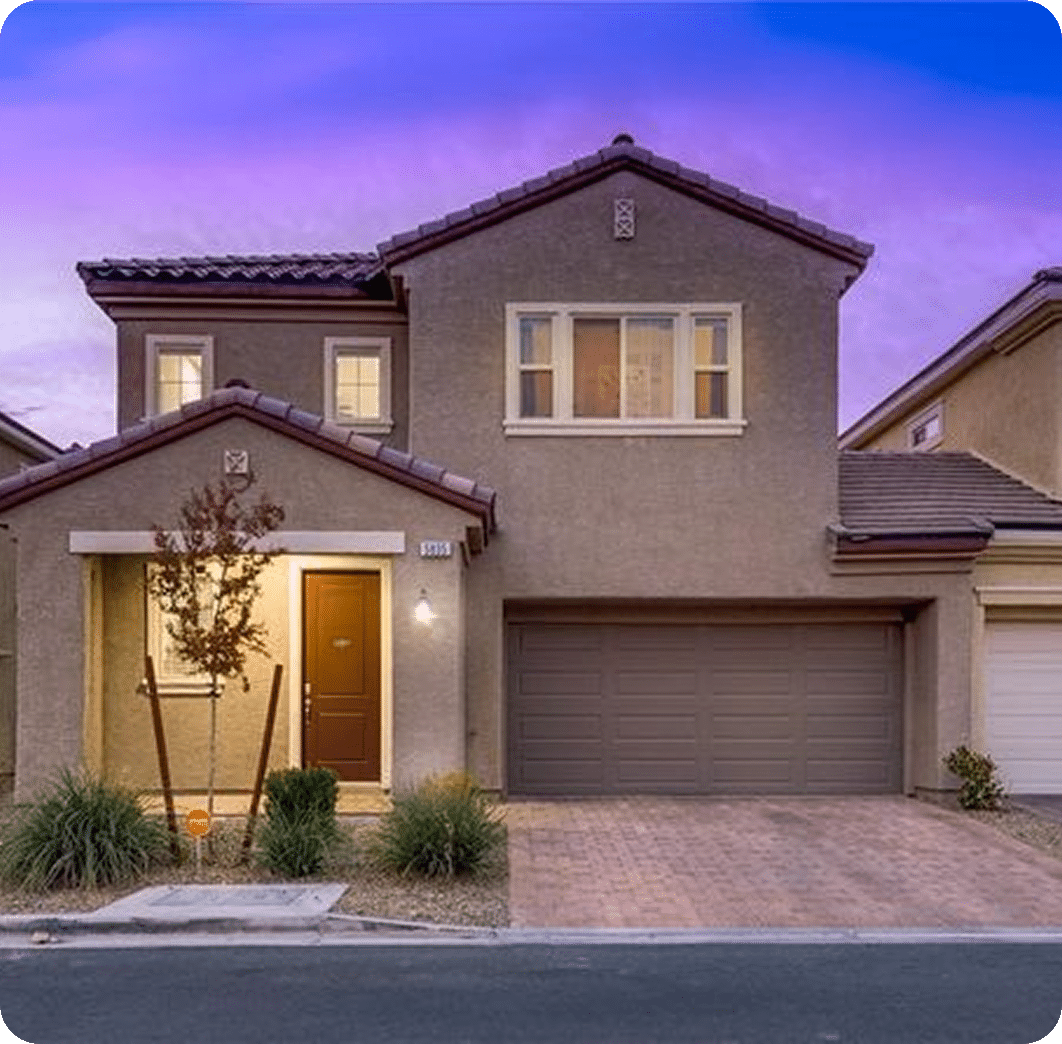 Modern house with purple sunset backdrop
