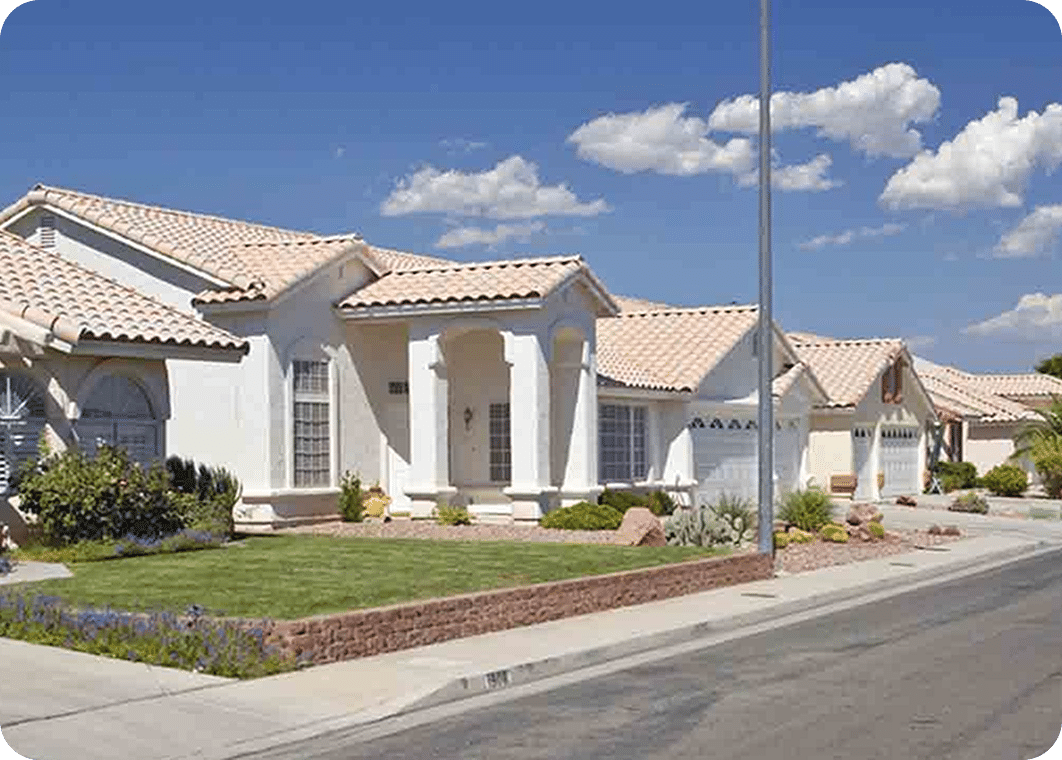 Suburban houses under a blue sky